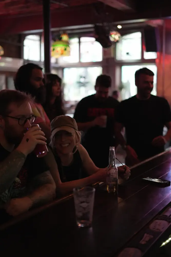 Regulars laughing at the bar